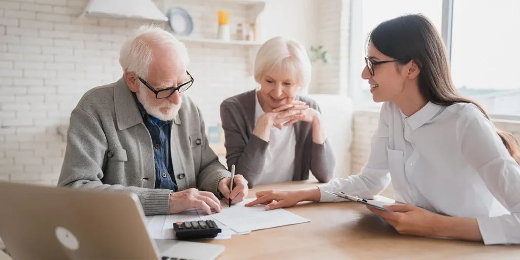 Elderly couple signing Lasting power of attorney - Guide To Understanding the Lasting Power of Attorney