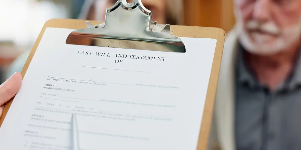 Last Will and Testament document with an older gentleman in the background creating his will, representing the importance of Deeds of Variation and inheritance planning.
