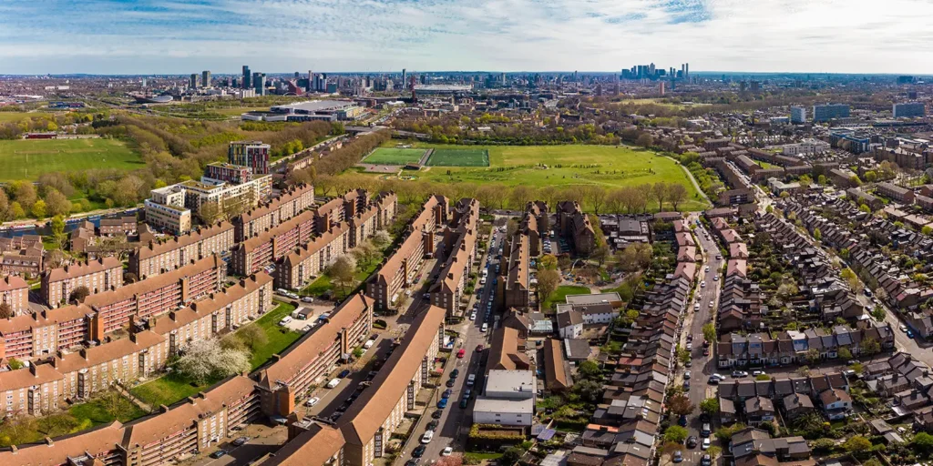 Aerial view of London residential housing estates and green spaces, illustrating urban rented homes and land law context.